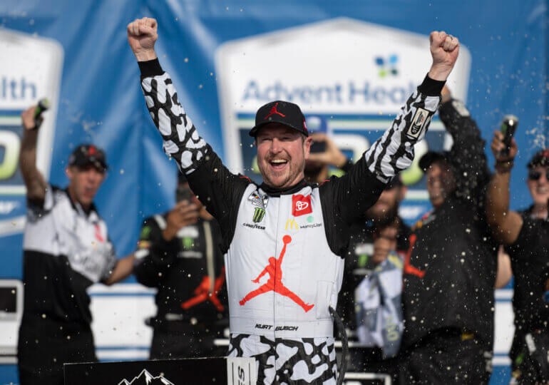 Kurt Busch chases down Kyle Larson, earns first win at 23XI